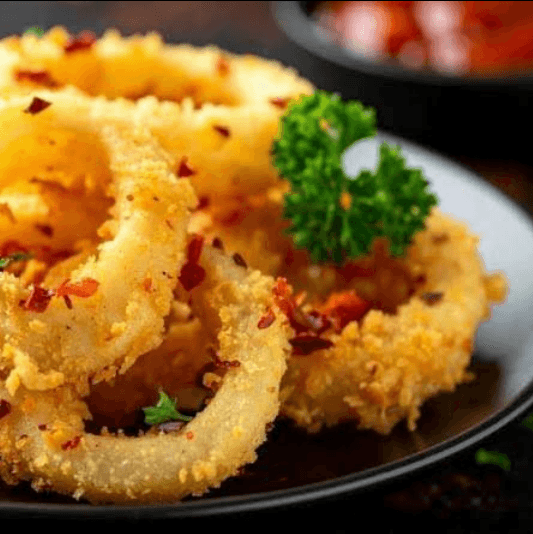 Fried calamari rings with lemon